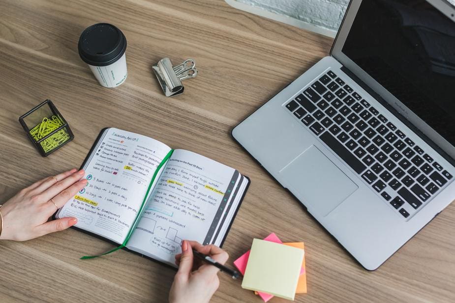 writing-in-notebook_925x