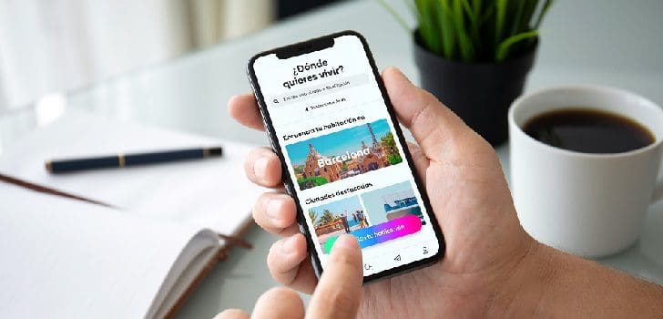 man hands holding phone with isolated screen in office